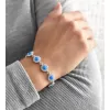 Stříbrný náramek se syntetickým opálem a krystaly Preciosa modrý 33105.1
