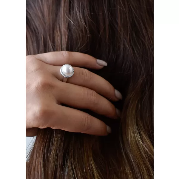 Stříbrný prsten s krystaly Swarovski a bílou perlou 35021.1