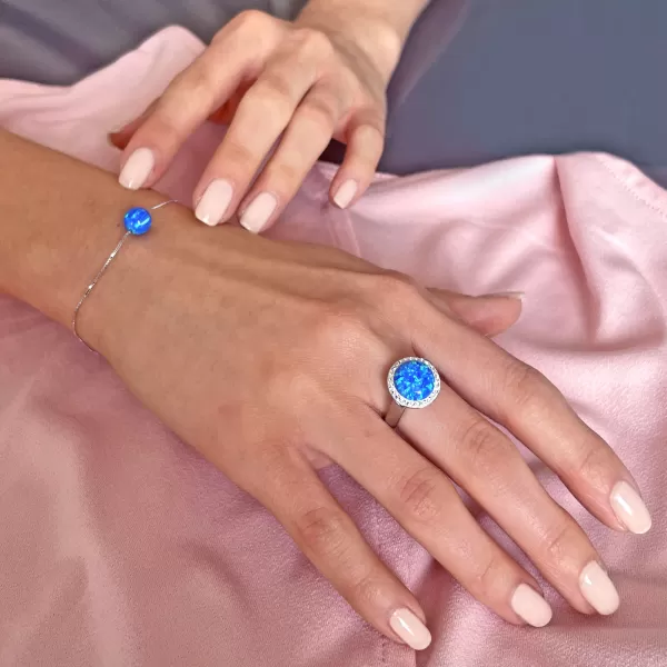 Stříbrný prsten se syntetickým opálem a krystaly Preciosa modrý 35060.1