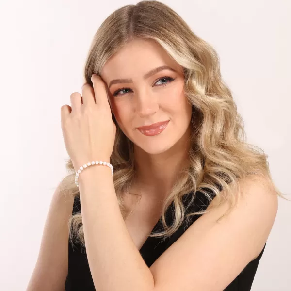 Stříbrný pozlacený náramek s bílými skleněnými korálky 13075.3 AU