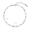 Stříbrný náramek s perlami a howlity 13113.1