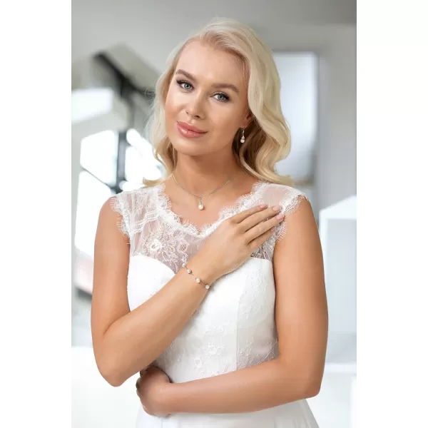 Stříbrné visací náušnice s bílou říční perlou a zirkony 21062.1