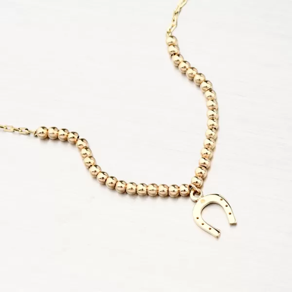 Dámský náramek žluté zlato 585 kuličkami a podkovou 144P-141240