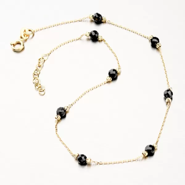 Zlatý náramek na nohu s černými krystaly PKL14-025